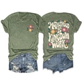 Detailed flat lay of a green floral t-shirt with Motherhood Is Kingdom back graphic print - S / Olive Green