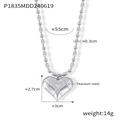Macro view of titanium steel heart pendant with grid texture and oval bead chain details - Steel Color Small Rice Bead Necklace (P1835)