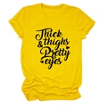 Detailed view of yellow cotton t-shirt with Thick Thighs Pretty Eyes lettering print - S / Yellow