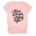 Close-up of pink crew neck T-shirt with black Thick & Thighs Pretty Eyes lettering - S / Pink