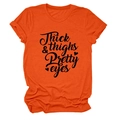Detail of orange cotton t-shirt featuring thick thighs pretty eyes text and rolled sleeves - S / Orange