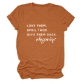 Detail of Love Them Spoil Them text on brick red heather fabric crew neck t-shirt - Burnt Orange (White Font)