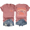 Detail of V-neck T-shirt with Sunset print and Forever Chasing Sunsets text design - Rose Gold