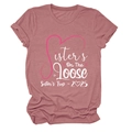 Close-up of Sisters On The Loose print on pink crew neck cotton t-shirt for sister trip - S / Tops / Rose Gold (White Text)