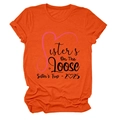 Detailed flat lay of orange crew neck T-shirt with black Sisters On The Loose print - S / Tops / Orange