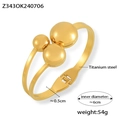 Bracciale rigido in acciaio al titanio dorato con tre sfere lucide e design a doppia banda - Oro