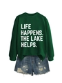 Detail of green long sleeve sweatshirt with Life Happens The Lake Helps text print - Dark Green (White Font)