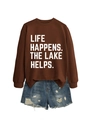 Detail view of brown crewneck sweatshirt with 'LIFE HAPPENS. THE LAKE HELPS.' white text - Brown (White Font)