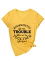 Detail of yellow V-neck T-shirt showing printed text graphic and side knot detail - S / Yellow (Black Font)
