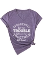 Detail of purple V-neck T-shirt showing white graphic print and stylish knotted hem - Purple (White Font)