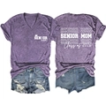 Detailed front and back views of V-neck Senior Mom Class of 2026 shirt and denim shorts - Purple (White Font Print)