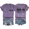 Detailed front and back view of purple V-neck Senior Mom 2026 shirt with denim shorts - Purple (Black Font Print)
