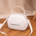 White mini round PU leather crossbody bag with double zippers and black letter print - White