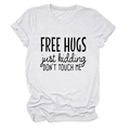 Detail of Free Hugs slogan print on white cotton crew neck t-shirt with rolled sleeves - White (Black Font)