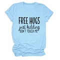 Detail of rolled cuffs and Free Hugs slogan print on light blue cotton t-shirt - Light Blue (Black Font)