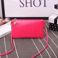 Fuchsia crocodile embossed small crossbody bag with gold-tone hardware and slim strap - Rose Red