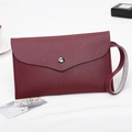 Burgundy envelope clutch bag with lychee texture and silver snap button closure - Burgundy