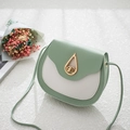 Contrast color mint green saddle bag with gold teardrop lock and slim shoulder strap - Light Green