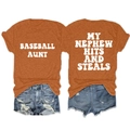 Flat lay of an orange cotton blend T-shirt and distressed denim shorts outfit set - Burnt Orange with White Print
