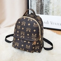 Mini British style retro backpack in dark brown faux leather with brand monogram pattern - Coffee