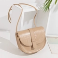 Beige crocodile pattern saddle bag with thin shoulder strap and modern flip-top design - Khaki