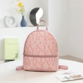 Pink fashion backpack with Lucky Girl print and adjustable straps on a white table - Pink