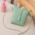 Chic mint green leather bucket bag with gold buckle and slim crossbody strap - Light Green