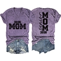 Detail of purple Senior Mom 2026 t-shirt with textured fabric and denim shorts - Purple (Black Font)