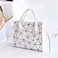 White geometric triangle grid handbag with dual handles and gold buckle closure - White Argyle
