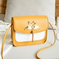 Elegant yellow and white two-tone shoulder bag with swan tassel buckle and pebble leather - Yellow