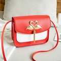 Women's small square shoulder bag with red and white color block and golden swan buckle - Red