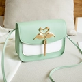 Chic mint green and white crossbody bag with gold swan buckle and tassel detail - Green