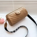 Quilted V-pattern khaki cylinder shoulder bag with butterfly detail and wide strap - Khaki