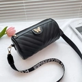 Black V-quilted cylinder crossbody bag with golden butterfly and jacquard strap - Black