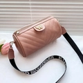 Pink V-quilted cylinder crossbody bag with golden butterfly clasp and wide logo strap - Pink
