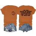 Detailed front and back views of orange graphic tee and distressed denim shorts - Burnt Orange (Black Font)