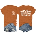 Macro detail of vintage orange t-shirt featuring artistic text and peach graphic print - Burnt Orange (White Font)