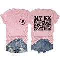 Flat lay of pink casual t-shirt with slogan print and distressed denim shorts - S / Pink