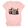 Detailed view of Kind Vibes printed text and heart motif on a light pink T-shirt - S / Pink