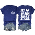 Navy Dance Mom short sleeve t-shirt paired with distressed denim shorts on white background - Retro Blue (White Font)