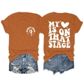 Front and back view of rust red T-shirt with My Heart is on That Stage text and denim shorts - Burnt Orange (White Font)