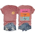 Flat lay of a red heather BOAT SUN LAKE T-shirt paired with distressed blue denim shorts - Rose Gold (Black Print)