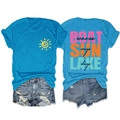 Flat lay of blue T-shirt with sun print and distressed denim shorts summer set - Lake Blue (Black Print)