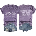 Detailed flat lay of purple V-neck t-shirt with kidney donor graphics and denim shorts - Purple (White Font)