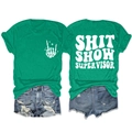 Detailed flat lay of green cotton tee with back text and distressed blue denim shorts - Dark Green (White Font)