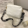White V-quilted crossbody bag with LOVE embroidered strap and gold tassel detail - White