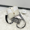 Modern white and yellow printed bucket bag with branded wide strap and gold twist lock - White