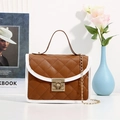 Brown and white quilted crossbody bag with golden chain and metallic lock detail - Brown
