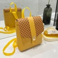 Yellow mini backpack with vintage pattern flap and gold-tone twist lock closure - Yellow