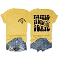 Flat lay detail of a yellow crew neck T-shirt with gothic Tatted and Toxic skull graphics - Yellow (Black Graphic)